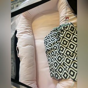 Dock a tot grand. Used 5x before child out grew. Blush cover brand new.